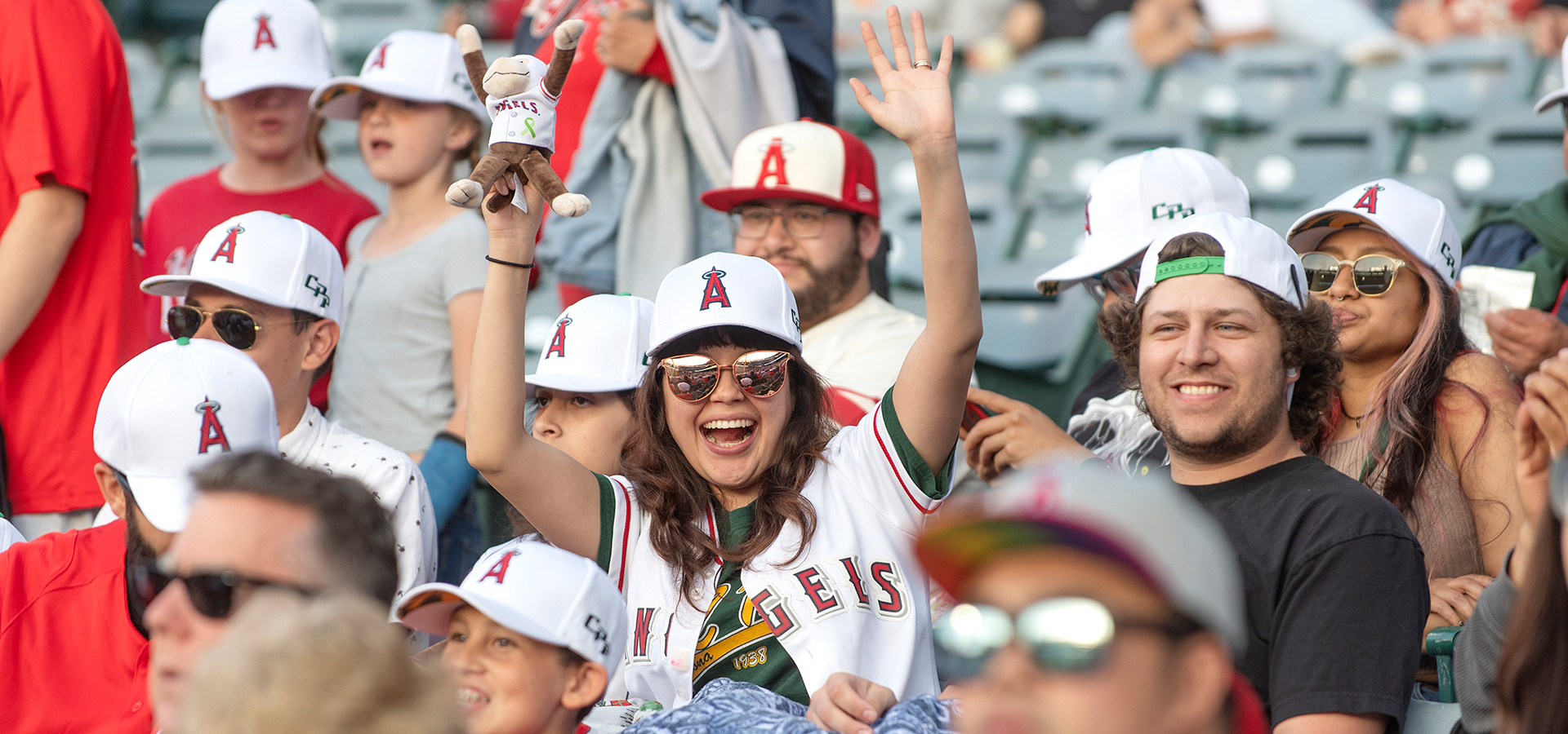 A female CPP fan smiles during the 2023 CPP night at Angel stadium.