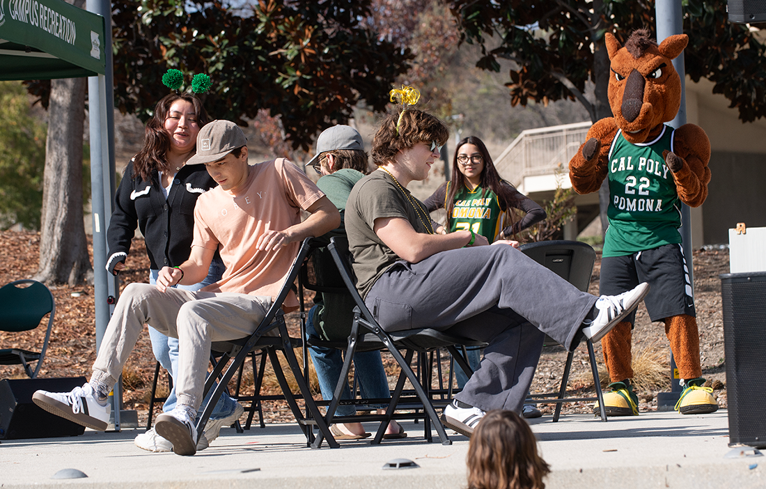 Students play a game of musical chairs during the 2025 Green and Gold party.