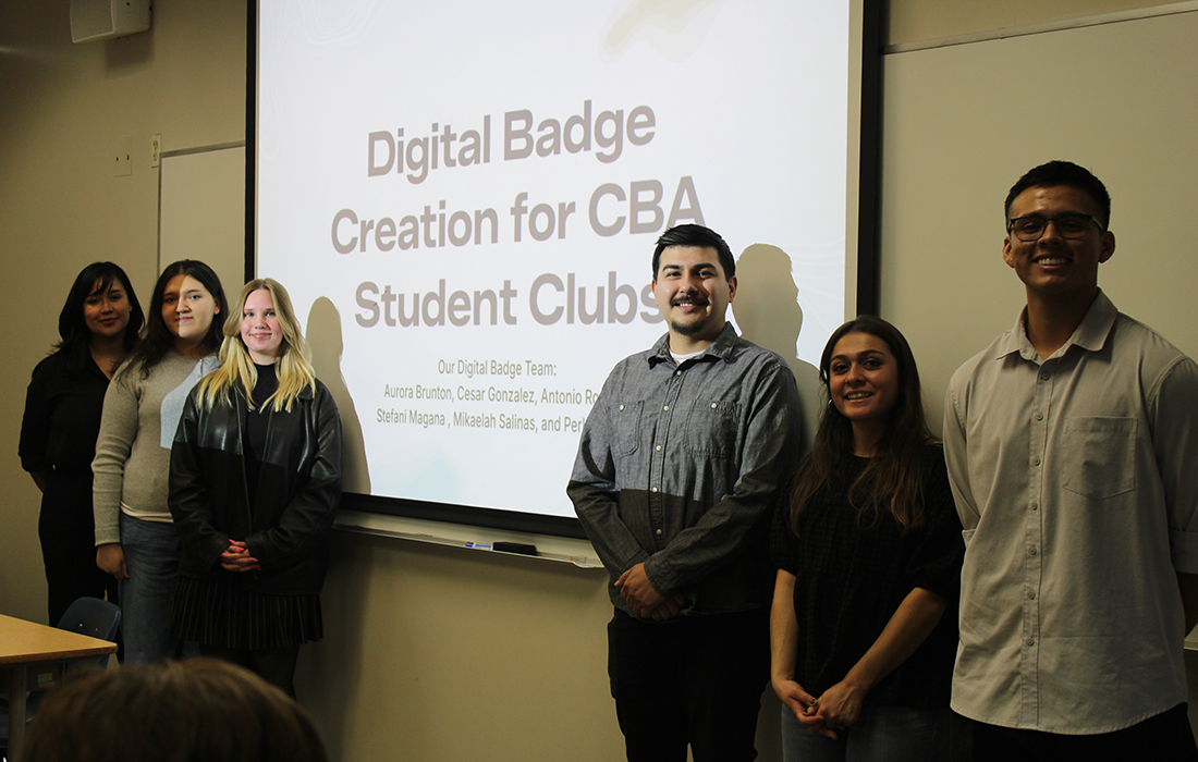 Students pose with during a presentation for digital badges. 