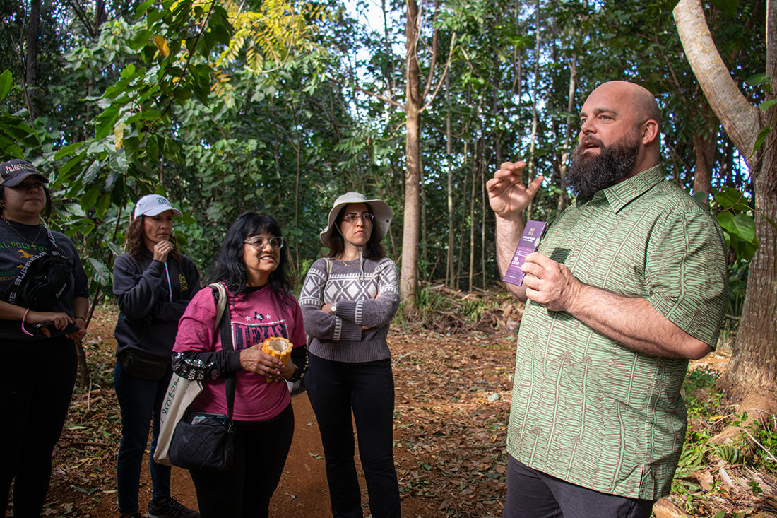 Students listen to a representative of Lydgate Farms on the Kauai Study Away trip.