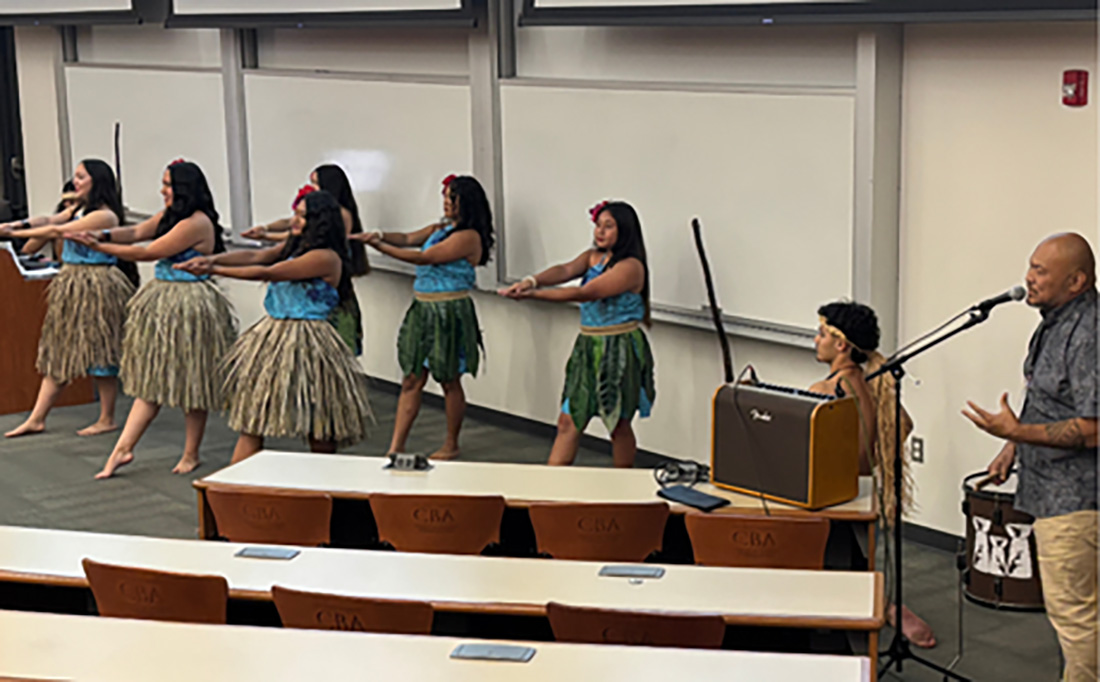 Group of students perform a Hula Dance on stage