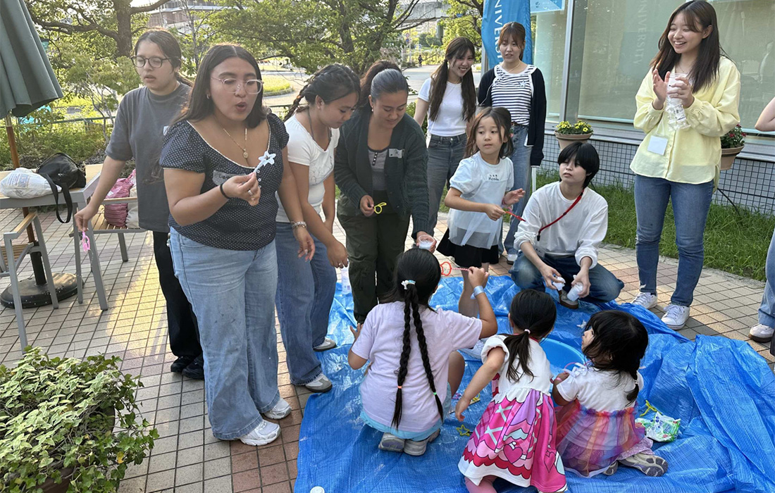 Students working with school children during the Japan study abroad program in June 2026. 