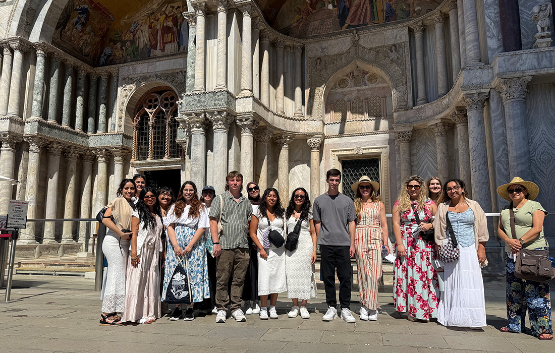 Kellogg Honors College students pose in front of a chapel in Italy.