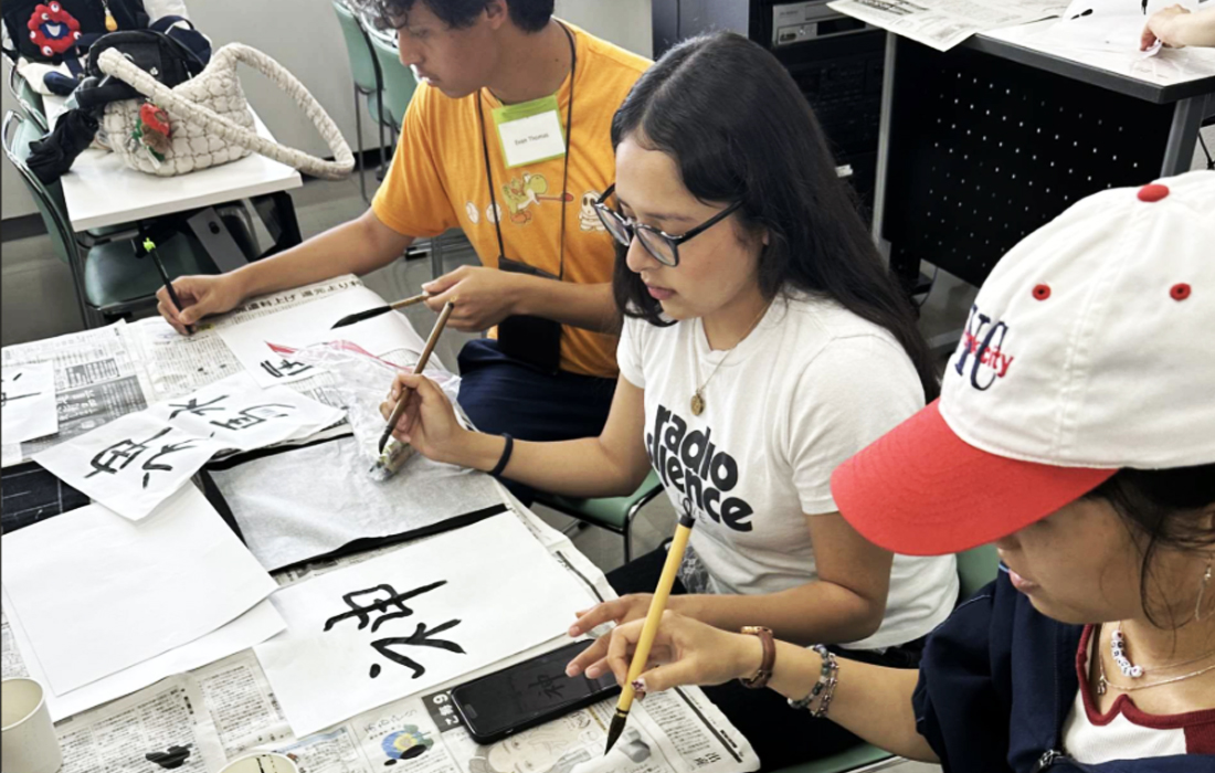 Students learning calligraphy