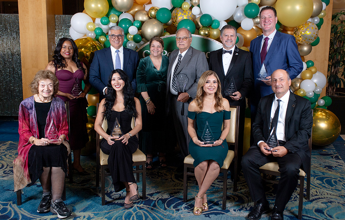 The 2026 Distinguished Alumni group with President Vanya Quinones (center)