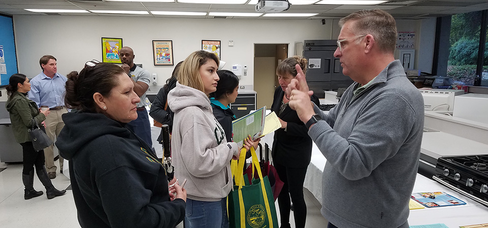 Visitors talk with nutrition and food science faculty