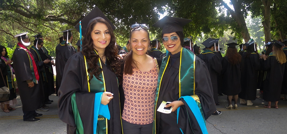 Rebecca Rivas and two graduates about to line up to march