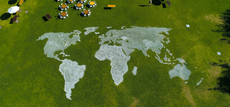 World map drawn on campus grass