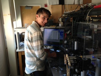 Nicholas Perez is setting up the optical fiber for tapering.