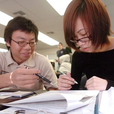 Students getting filling out papers