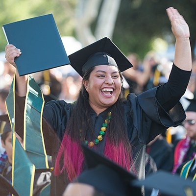 Graduate celebrating graduation.