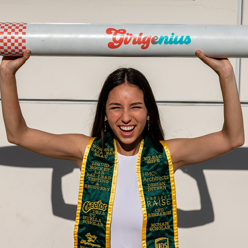 Laila Quesada holding a Rocket that says Girl Genius