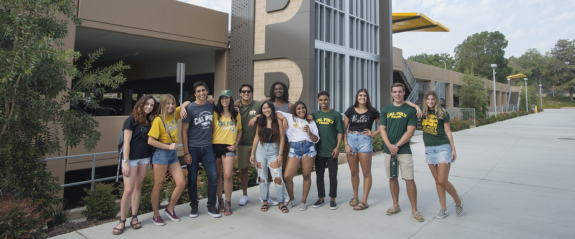 Cal Poly Pomona students pose by the mural. 