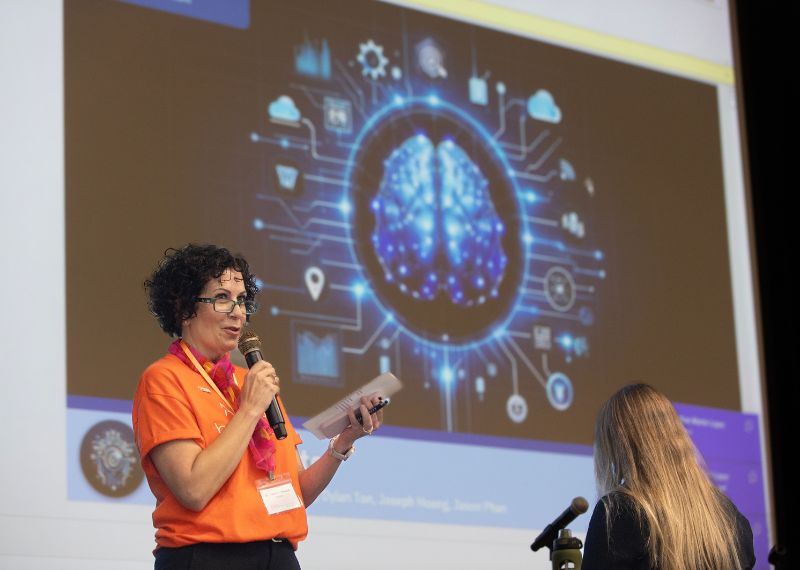 Presenter in front of a screen