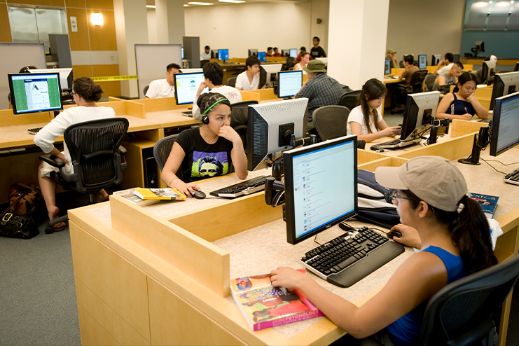 Students working on computers in the second floor of the library