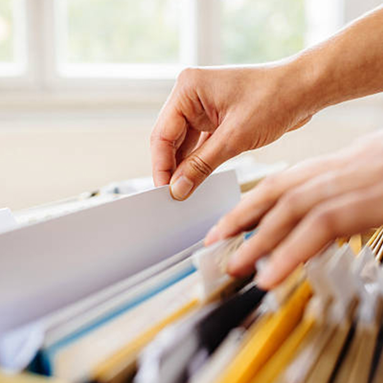 Photo of person filing documents