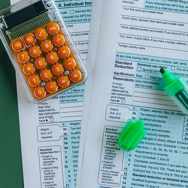 photo of calculator and papers