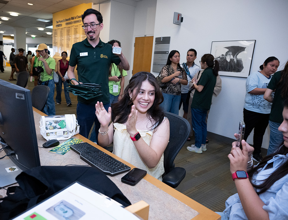 Student smiling after submitting her application