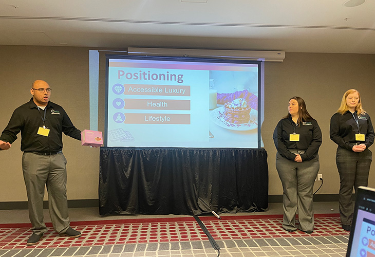 Cal Poly Pomona agribusiness students give a presentation at a competition.