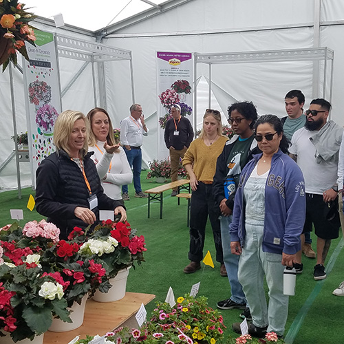 Students get a tour of a floral industry show