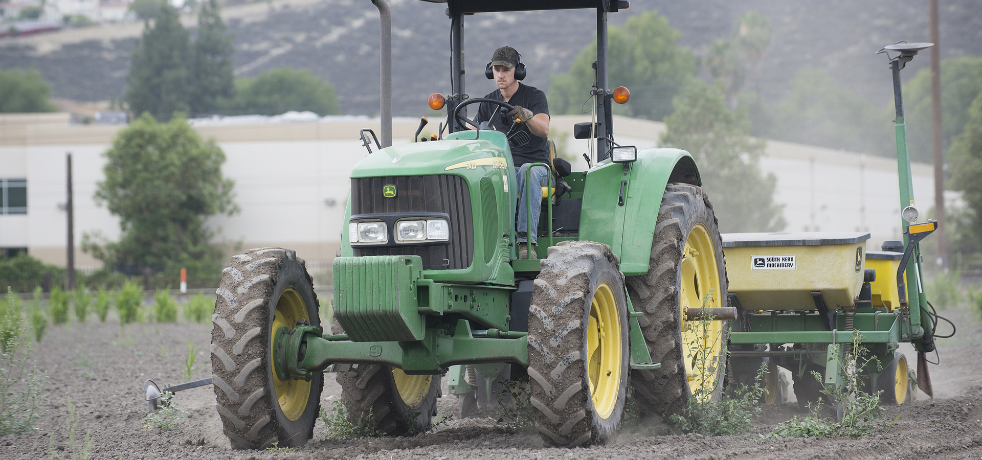 a senior plant science major, drives a tractor at Spadra Ranch