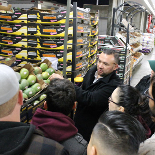 Students at a produce company