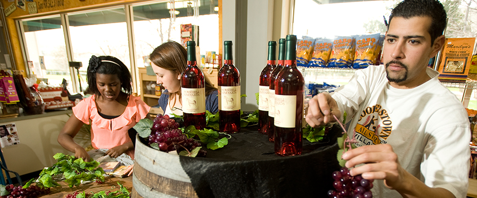 Students arrange wine