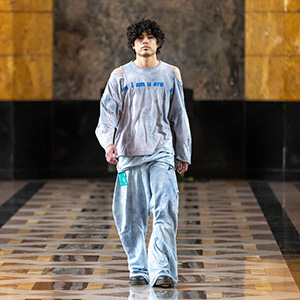 A male model walks at the fashion show