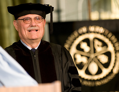 Don Huntley in a cap and gown