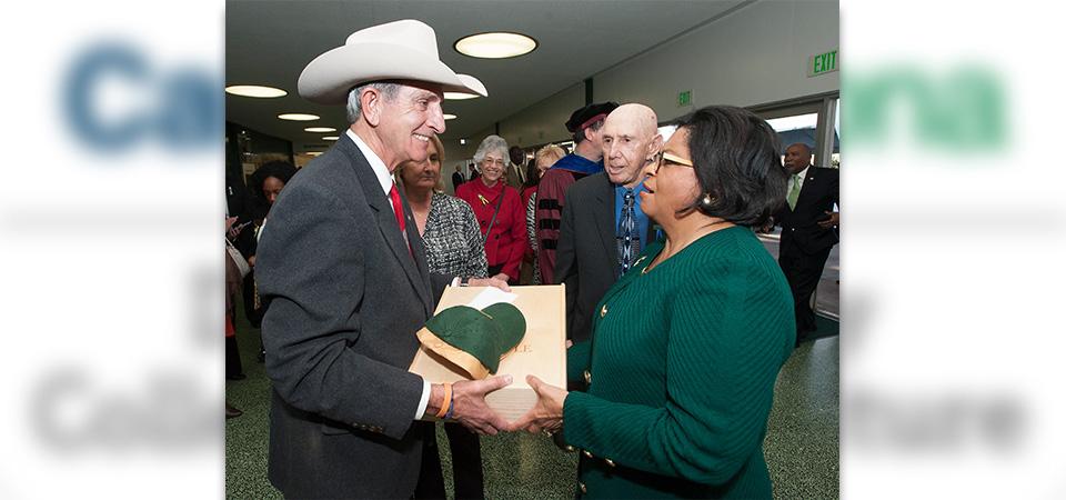 Scott W. Dunn greets Cal Poly Pomona President Soraya Coley