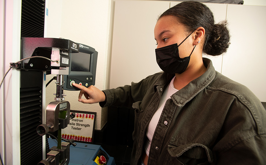 A student tests the strength of cactus leather