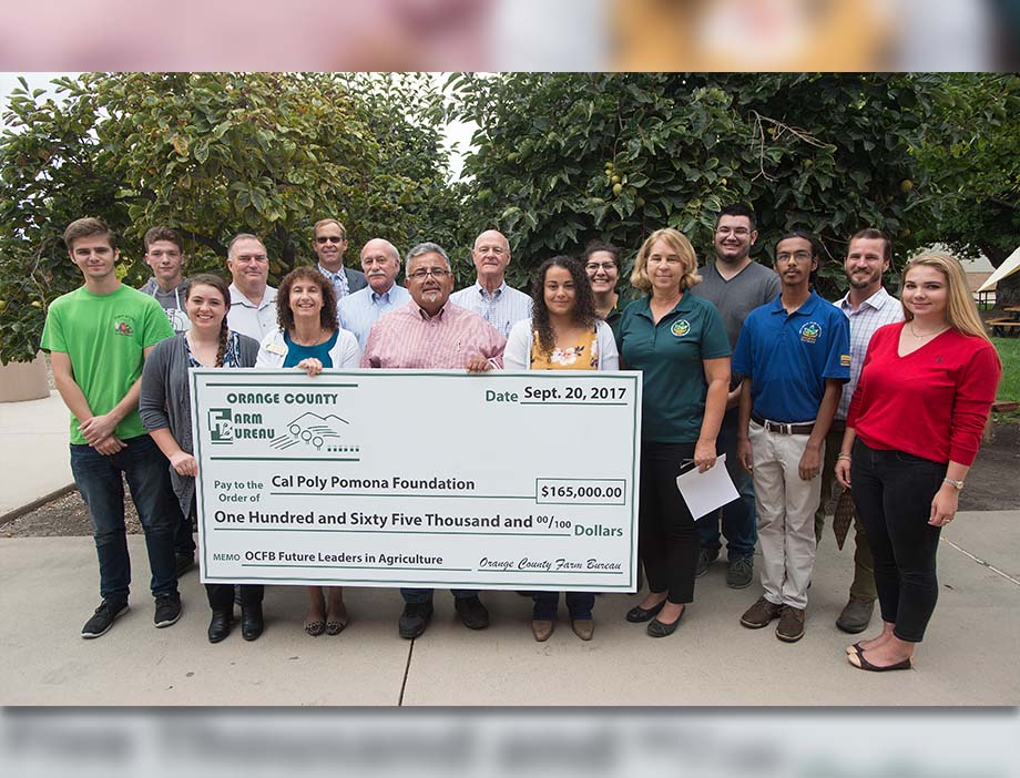 Orange County Farm Bureau reps pose with CPP students and a check. 
