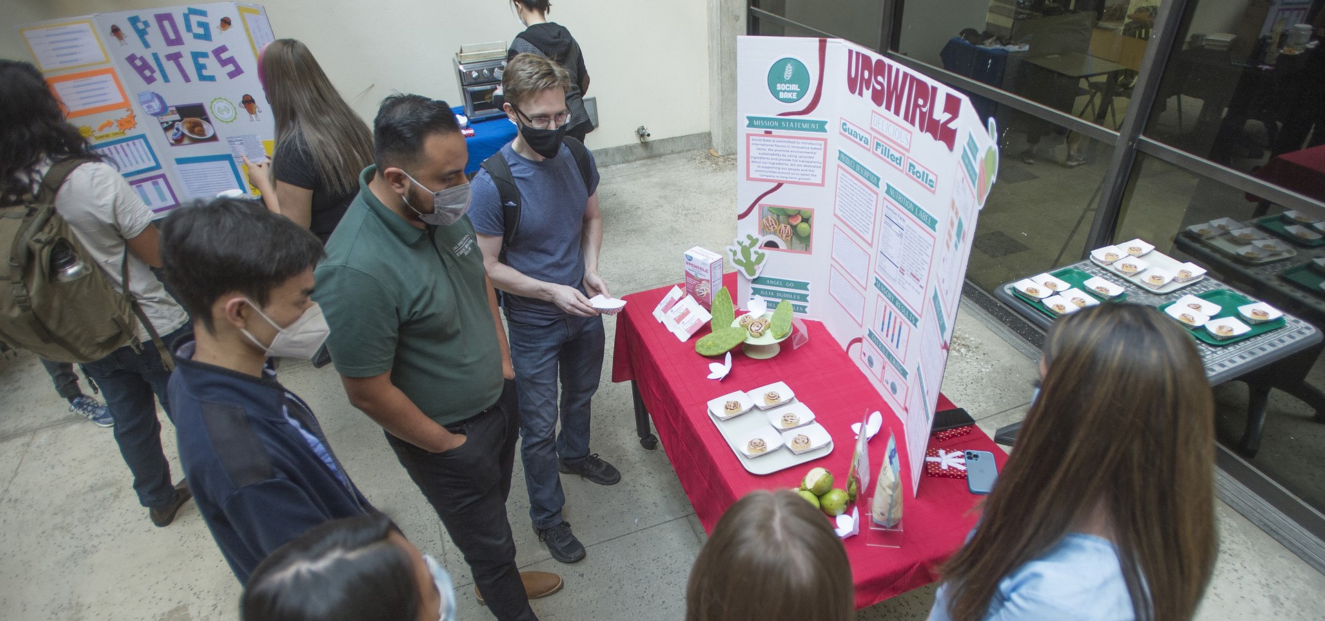 Students listen to student presenters about their Upswirlz product