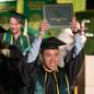 College of Agriculture Graduate Raises His Diploma