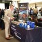 Student talks with company representatives at 2017 Ag Career Day