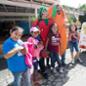 Two Cal Poly Pomona students pose with schoolchildren at a "Healthy Eats" nutrition presentation at the LA County Fair.