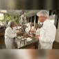 A professor and students work in a nutrition lab