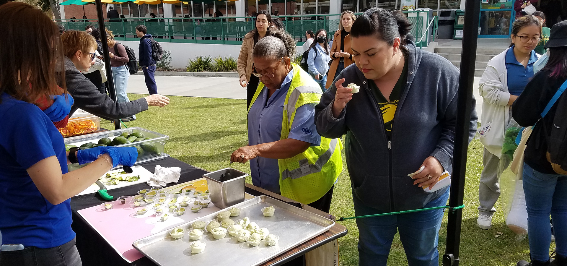 People picking up samples from the Coney Island Creamery booth
