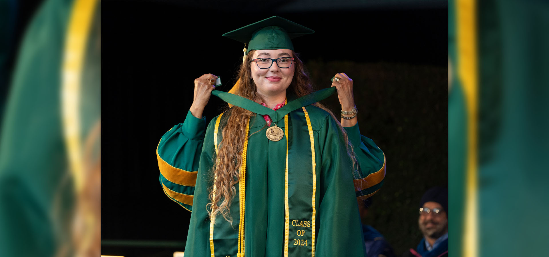 Pia Spors receives the medallion as McPhee Scholar