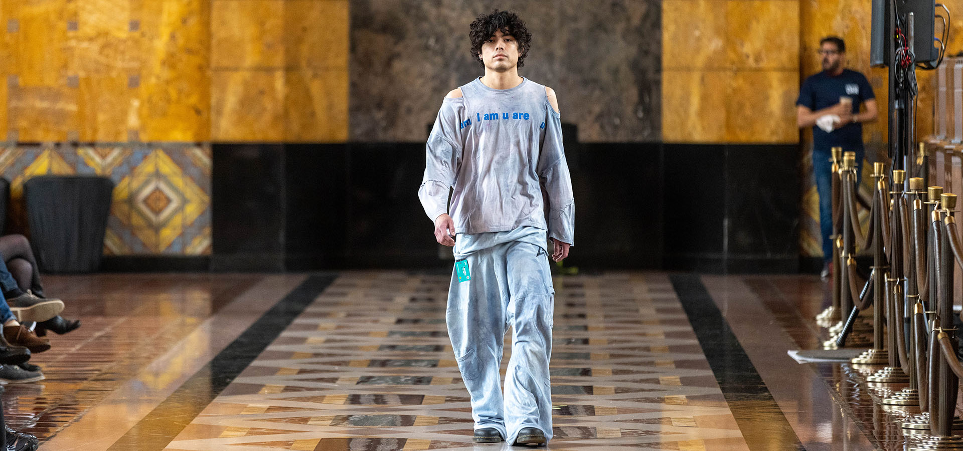 A male model walks at the fashion show