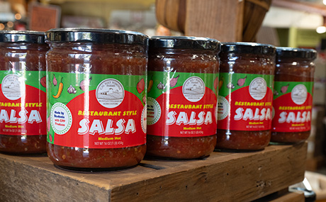 jars of salsa on a shelf