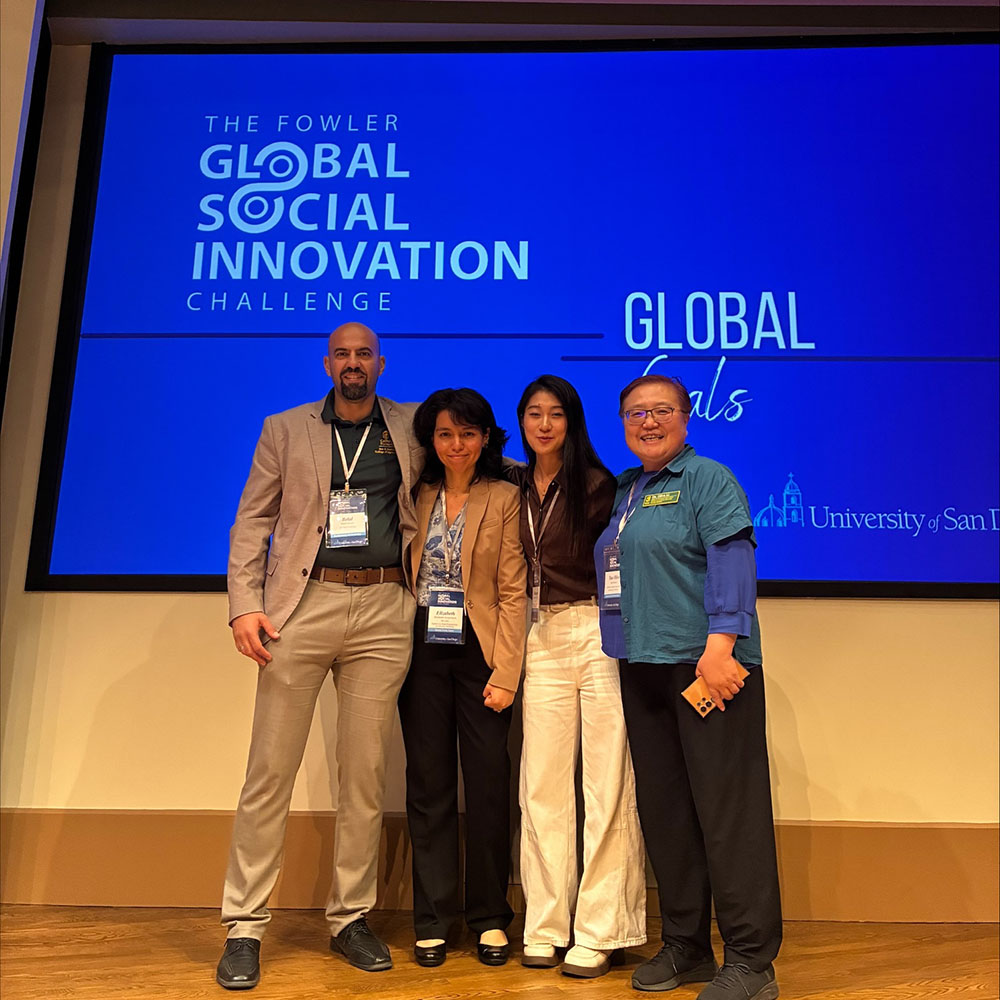 Groenheim and Shi pose with Professor Olive Li and Assistant Professor Belal Hasan
