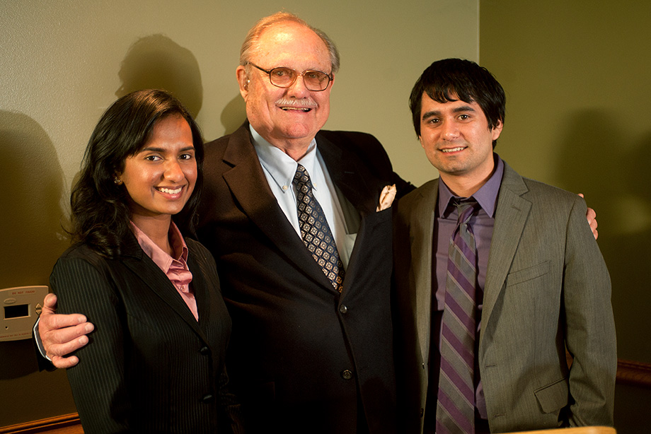 Don B. Huntley poses with two student recipients of biotech scholarships.