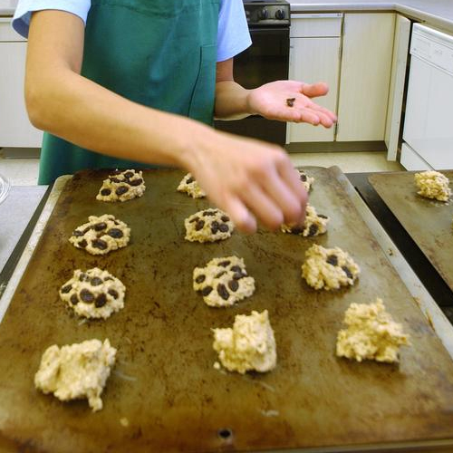 student counts out raisins for oatmeal raisin cookies at the