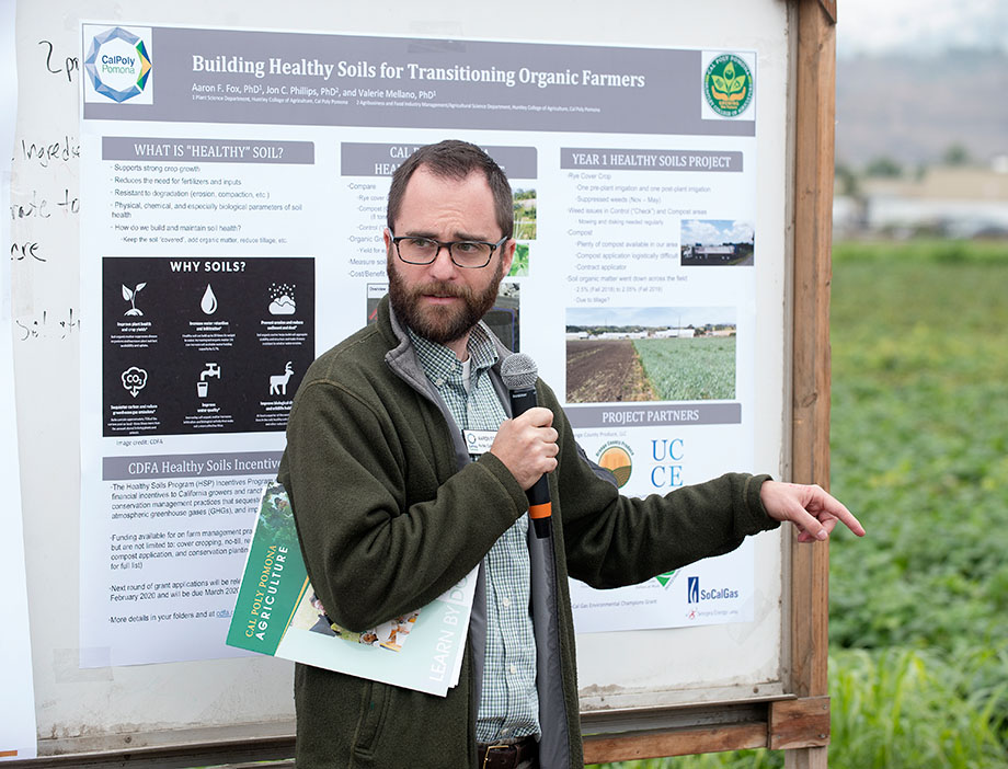 Professor Aaron Fox speaks about healthy soils at a Spadra Farm event.
