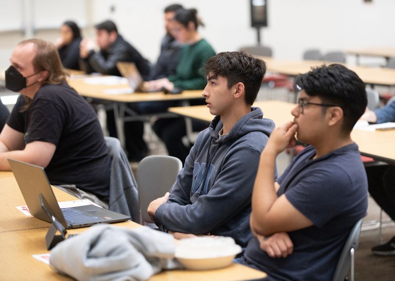 Two students listening in class.