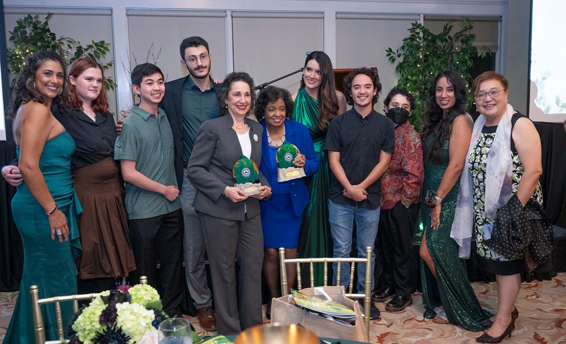 president levine and president colley posing with SIIL students for a photo