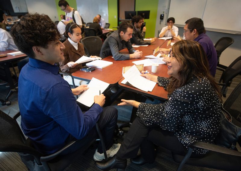 Faculty and students participate in a collaborative discussion at a professional development workshop.