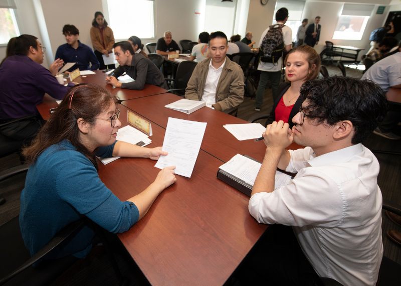  Faculty and students participate in an interactive discussion during an academic workshop.