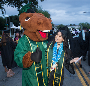Billy Bronco celebrating with a graduate